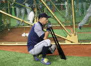 Seattle Mariners right fielder Ichiro Suzuki waits for batting prior to Game 1 of a Major League opening series baseball game against the Oakland Athletics at Tokyo Dome in Tokyo, Wednesday, March 20, 2019. (AP Photo/Koji Sasahara)