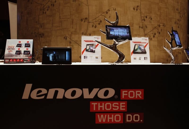 Lenovo tablets and mobile phones are displayed during a news conference on the company's annual results in Hong Kong in this May 23, 2013 file photo. REUTERS/Bobby Yip/Files