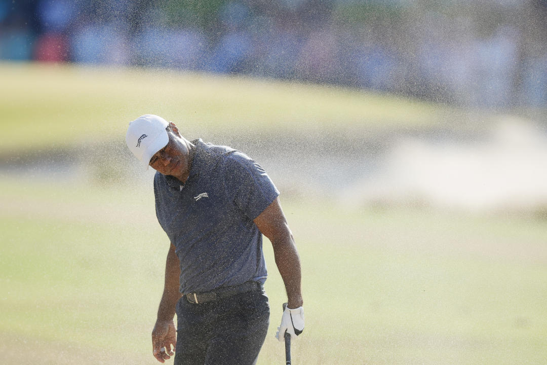 PINEHURST, NORTH CAROLINA - JUNE 14: Tiger Woods of the United States reacts after hitting from the rough on the 18th hole during the second round of the 124th U.S. Open at Pinehurst Resort on June 14, 2024 in Pinehurst, North Carolina. (Photo by Alex Slitz/Getty Images)