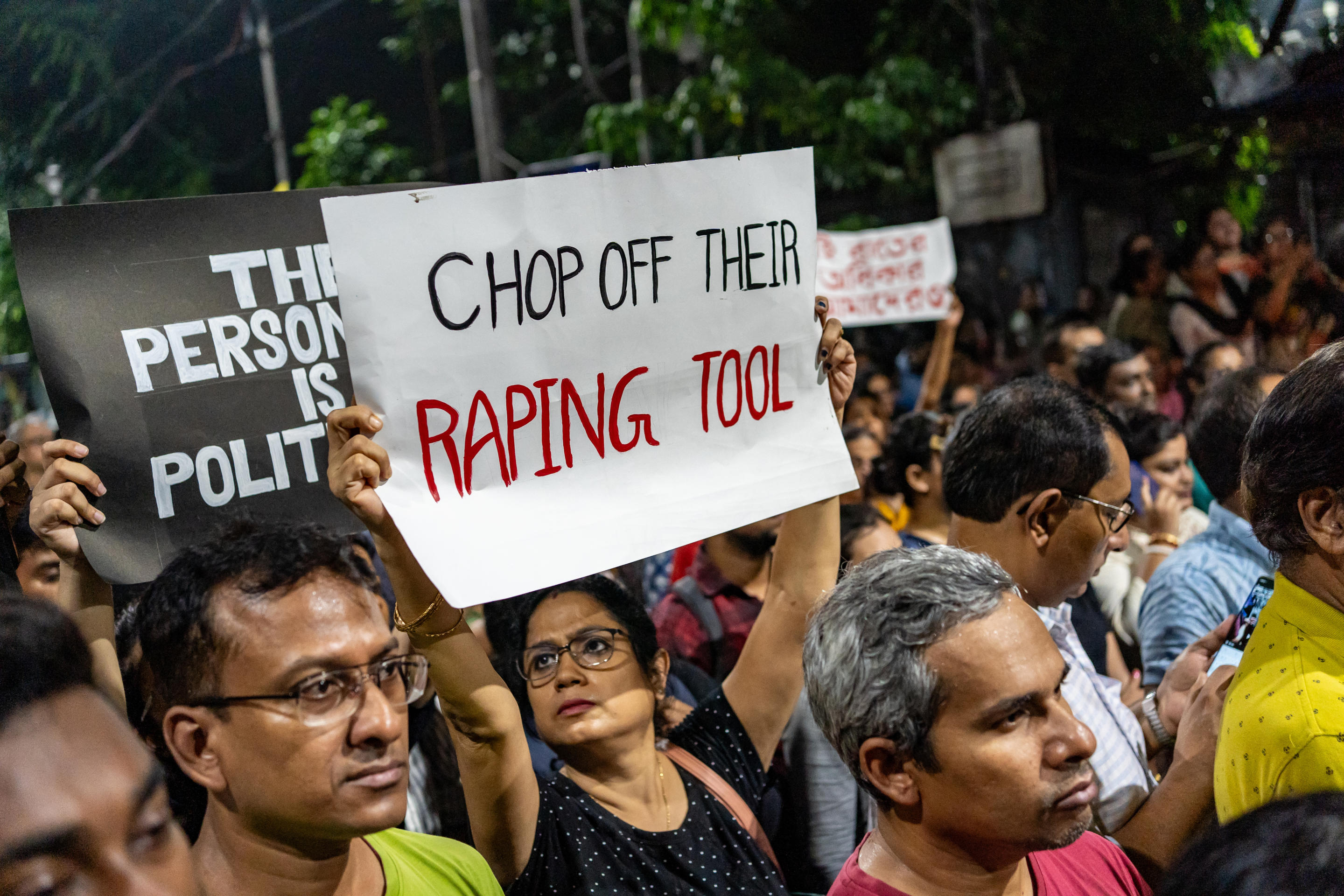 A protester holds a strongly worded placard during the demonstration against violence against women. 