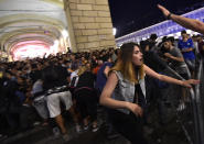<p>Juventus’ fans run away from San Carlo Square following panic created by the explosion of firecrackers as they was watching the match on a giant screen on June 3, 2017. (Giorgio Perottino/Reuters) </p>
