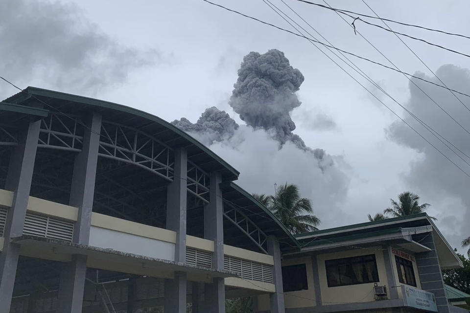 Ash and steam are spewed from Mount Bulusan as seen from Casiguran, Sorsogon province, Philippines on Sunday June 5, 2022. A volcano southeast of the Philippine capital spewed ash and steam about a kilometer into the sky in a brief steam-driven explosion on Sunday, scattering ash in nearby villages and alarming residents, officials said. (AP Photo/Karlyn Dupan Hamor)