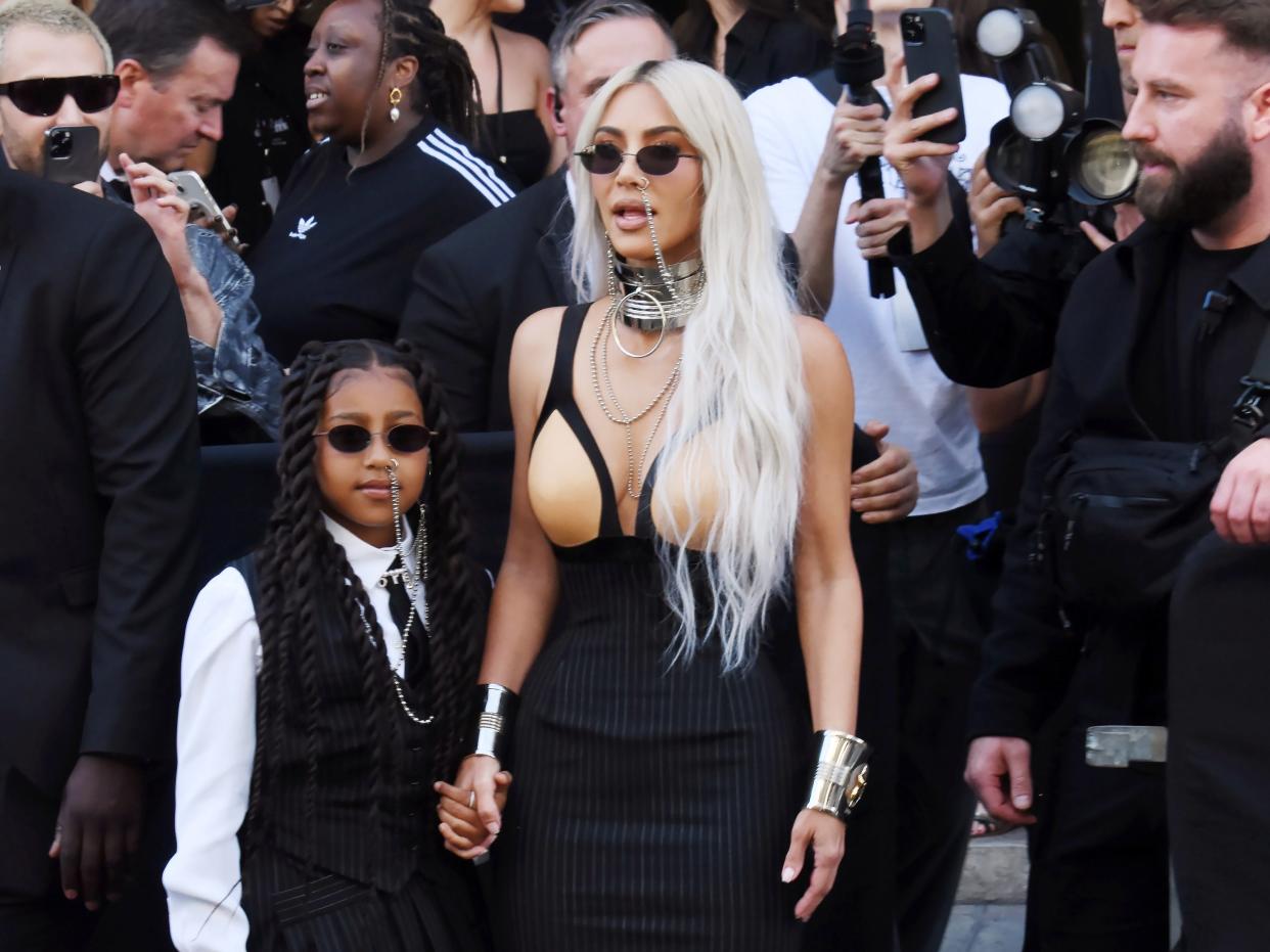 North West and Kim Kardashian attend the Jean Paul Gaultier Couture Show at Paris Fashion Week.