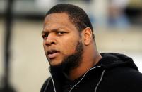 EUGENE, OR - DECEMBER 02 : Ndamukong Suh of the Detroit Lions, who is suspended for two games, looks on from the sidelines before the Pac-12 Championship game between the UCLA Bruins and the Oregon Ducks at Autzen Stadium on December 2, 2011 in Eugene, Oregon. (Photo by Steve Dykes/Getty Images)