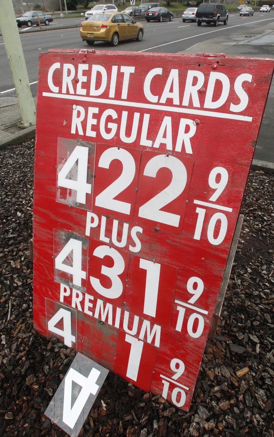 A sign in front of a filing station shows gasoline prices Tuesday, March 20, 2012, in Portland, Ore. Oregon's average gasoline price has hit $4. Retail gasoline prices in the U.S. are now averaging $3.846 per gallon, according to auto club AAA, Wright Express and Oil Price Information Service. A gallon of regular is the highest ever for this time of year. The national average has risen by 57 cents per gallon since January. (AP Photo/Rick Bowmer)