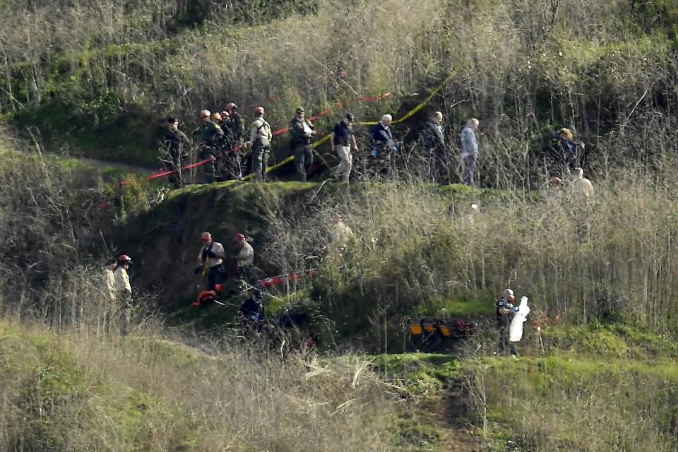Investigators work the scene of the helicopter crash on Jan. 27, 2020