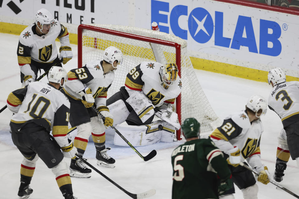 Vegas Golden Knights goaltender Laurent Brossoit (39) blocks the puck during the third period of an NHL hockey game against the Minnesota Wild, Monday, April 3, 2023, in St. Paul, Minn. (AP Photo/Stacy Bengs)