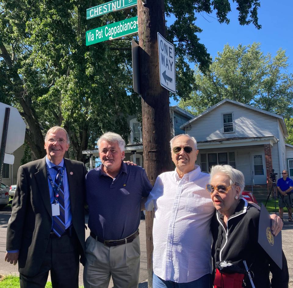 The city of Erie paid tribute to Pat Cappabianca by unveiling a street sign for him between 16th and W. 18th streets on Friday. Standing, from left, are Mayor Joe Schember, former Mayor Richard Filippi, Cappabianca and former Mayor Joyce Savocchio.