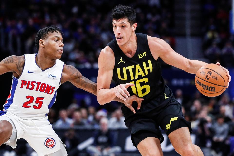 Detroit Pistons guard Marcus Sasser defends Utah Jazz forward Simone Fontecchio during the first half at Little Caesars Arena in Detroit on Thursday, Dec. 21, 2023.