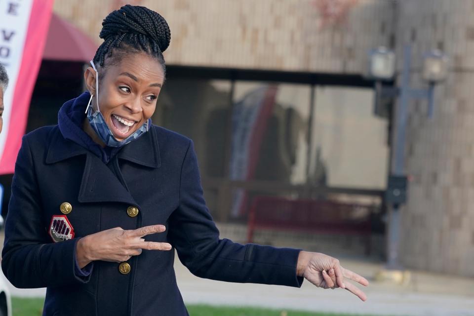 Then Democratic candidate Shontel Brown shares a laugh with people at the Bedford Community Center, Tuesday, Nov. 2, 2021, in Bedford Heights, Ohio. Brown is currently serving as a House Representative of Ohio's 11th Congressional Distric