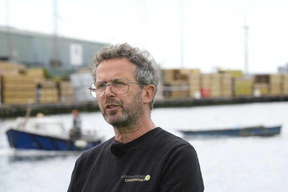 Matt Brown, New rojects Director at Brighton Energy Co Op speaks to Associated Press near Shoreham Port, East Sussex, England, Wednesday, June 12, 2024. There’s lots of talk of change in Britain’s election campaign, but little talk about climate change. The U.K.’s July 4 vote to choose a new government comes after one of the wettest and warmest winters on record, part of trends scientists attribute to global warming. (AP Photo/Kirsty Wigglesworth)