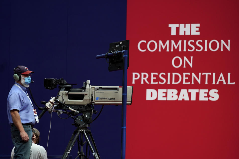 A camera operator waits for a rehearsal ahead of the first presidential debate between Republican candidate President Donald Trump and Democratic candidate former Vice President Joe Biden at the Health Education Campus of Case Western Reserve University, Monday, Sept. 28, 2020, in Cleveland. (AP Photo/Julio Cortez)