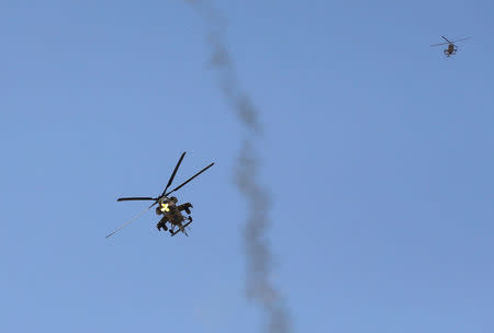 An Iraqi Air Force helicopter fires missiles against Islamic State fighters in north west of Mosul, Iraq, May 8, 2017. REUTERS/Danish Siddiqui