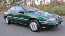 <p><strong>West Coast Editor, James Riswick:</strong> Is a 1994 Pontiac Grand Am objectively a good car? Oh hell no. But <a href="http://rover.ebay.com/rover/1/711-53200-19255-0/1?ff3=4&pub=5575459679&toolid=10001&campid=5338477336&customid=&mpre=https%3A%2F%2Fwww.ebay.com%2Fitm%2F1994-Pontiac-Grand-Am-SE%2F303353104608%3Fhash%3Ditem46a14108e0%253Ag%253A7aUAAOSwOYZdxZFD%26LH_BIN%3D1" rel="nofollow noopener" target="_blank" data-ylk="slk:this particular 1994 Pontiac Grand Am;elm:context_link;itc:0;sec:content-canvas" class="link ">this particular 1994 Pontiac Grand Am</a> is basically a brand new car. It has only 26,000 miles and the interior is SPOTLESS. It still has plastic on the carpets from the dealer. I'd be somewhat concerned about the thing barely running in 25 years, but apparently a full service has been performed, and how could it be worse than all the beaters at this price point? Seriously, this is absolutely my best bet. And honestly, I think the Grand Am looks pretty good and green-on-tan is a classy color combo.</p>