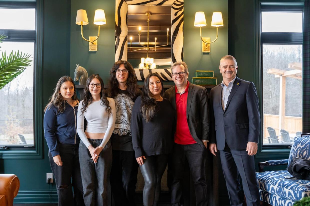 Tanya Lalonde, her husband David and their three children Lexi, Emmi and Luka with CHEO Foundation CEO Steve Read on Jan. 5 at the dream home they won in Ottawa. (Submitted by CHEO - image credit)