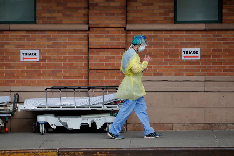 Healthcare worker outside Maimonides Medical Center during outbreak of coronavirus disease (COVID-19) in Brooklyn New York
