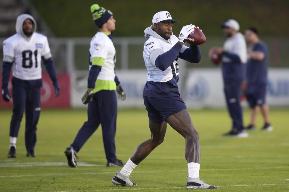 Seattle Seahawks' DK Metcalf catches a ball during a practice session in Munich, Germany, Thursday, Nov. 10, 2022. The Tampa Bay Buccaneers are set to play the Seattle Seahawks in an NFL game at the Allianz Arena in Munich on Sunday. (AP Photo/Matthias Schrader)