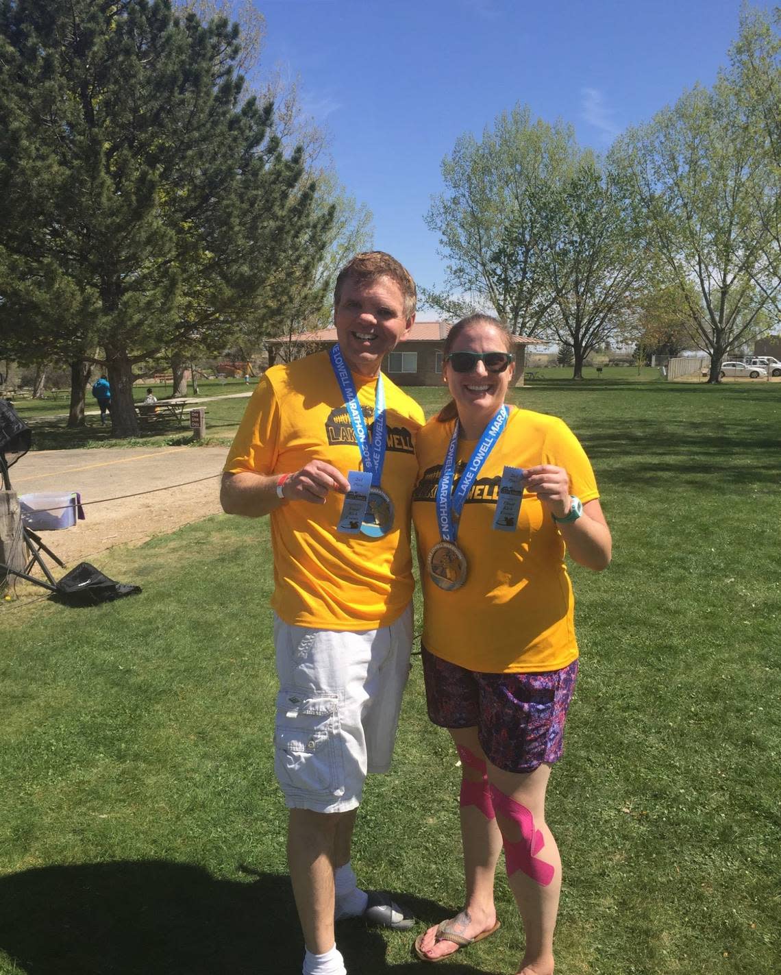 Bob Mueller, left, and Courtney Murray pose with their medals after completing the Lake Lowell Marathon in Nampa in 2016.