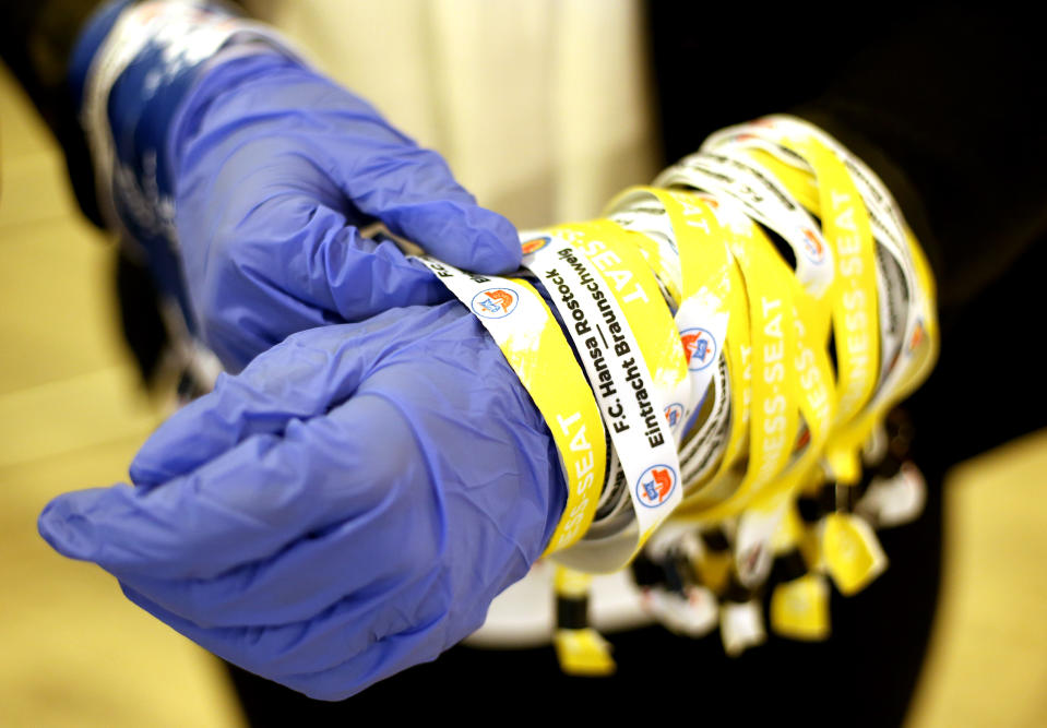 In precaution of the coronavirus, service staff wearing gloves prior to the 3. Liga match between Hansa Rostock and Eintracht Braunschweig at Ostseestadion on March 09, 2020 in Rostock, Germany. (Photo by Cathrin Mueller/Getty Images for DFB)