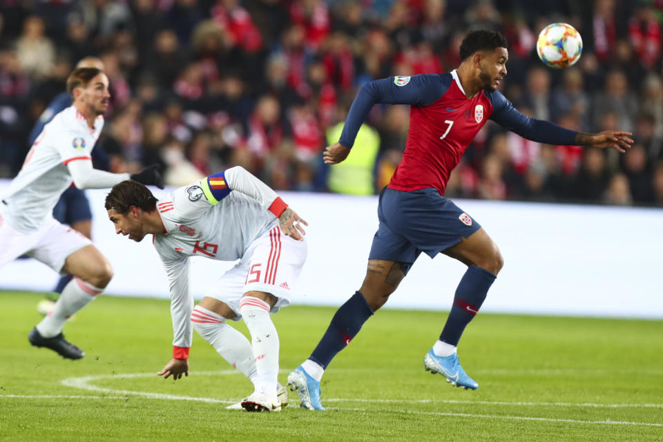 Spain's Sergio Ramos, left, fights for the ball against Norway's Joshua King, right, during the UEFA Euro 2020 qualifying Group F soccer match between Norway and Spain at Ullevaal Stadium in Oslo, Norway on Saturday, Oct. 12, 2019. (Tore Meek/NTB scanpix via AP)