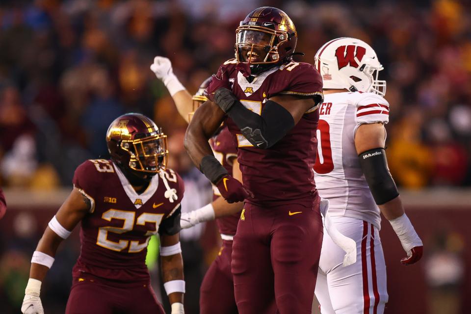 Nov 27, 2021; Minneapolis, Minnesota, USA; Minnesota Gophers defensive lineman Esezi Otomewo (9) reacts after a play during the second quarter against the Wisconsin Badgers at Huntington Bank Stadium. Mandatory Credit: Harrison Barden-USA TODAY Sports