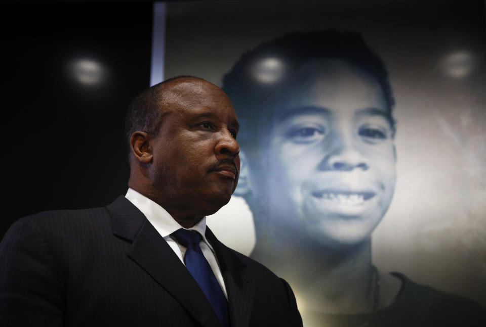 Inglewood Mayor James Butts stands in front of a photo of William Tillett during a news conference Wednesday, Feb. 20, 2019, in Inglewood, Calif. Authorities say a 50-year-old man is in custody in connection with the kidnapping and killing of then 11-year-old Tillett in Southern California nearly three decades ago. (AP Photo/Jae C. Hong)