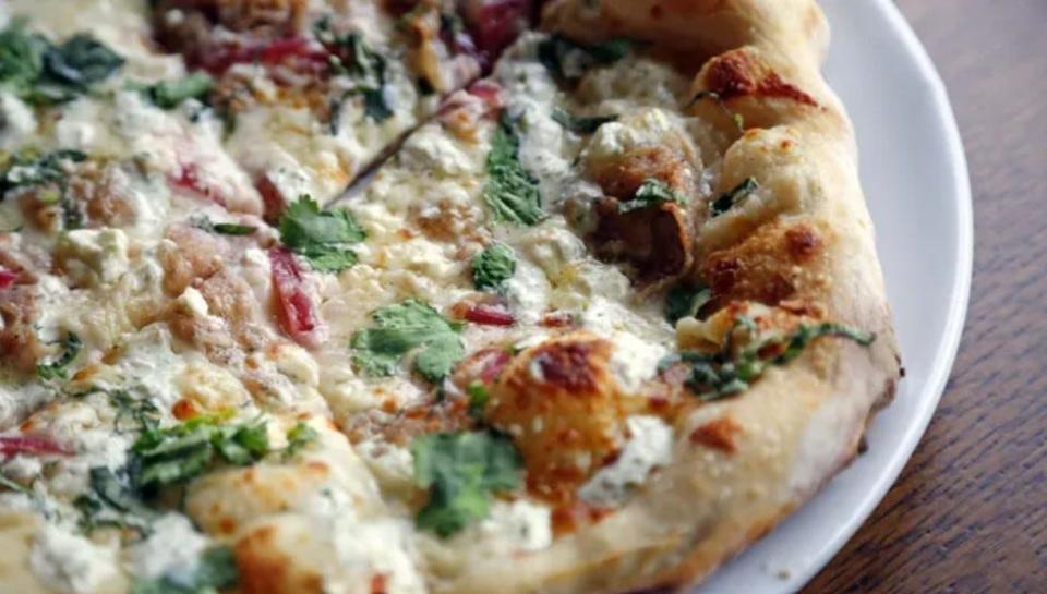 Eatery A leans into Mediterranean-inspired pies, such as the Pizza #5 with lamb gyro, feta, pickled onion, and raita.