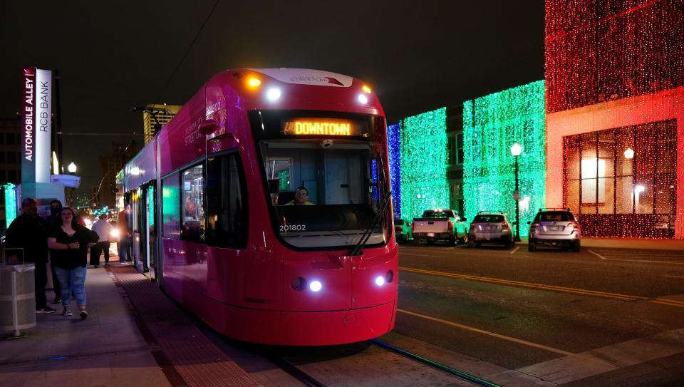 An OKC Streetcar makes a stop in 2021 at Lights on Broadway in Automobile Alley, part of Downtown in December.