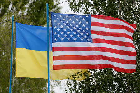 FILE PHOTO: National flags of Ukraine and the U.S. fly at a compound of a police training base outside Kiev, Ukraine May 6, 2016. REUTERS/Valentyn Ogirenko/File Photo
