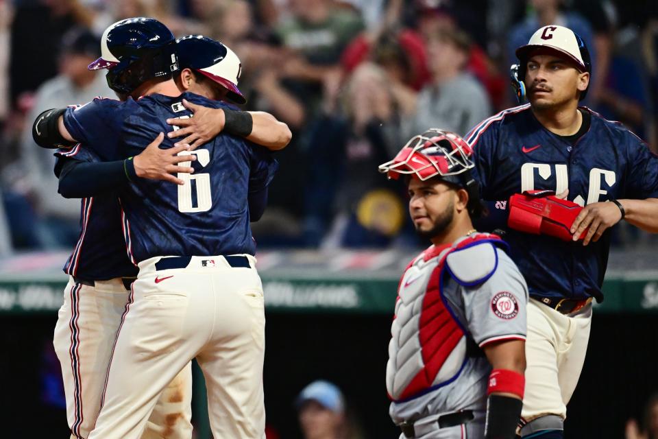 May 31, 2024; Cleveland, Ohio, USA; Cleveland Guardians catcher David Fry (6) hugs center fielder Tyler Freeman (2) after Fry’s three run home run, while first baseman Josh Naylor, right, and Washington Nationals catcher Keibert Ruiz (20) look on during the seventh inning at Progressive Field. Mandatory Credit: Ken Blaze-USA TODAY Sports