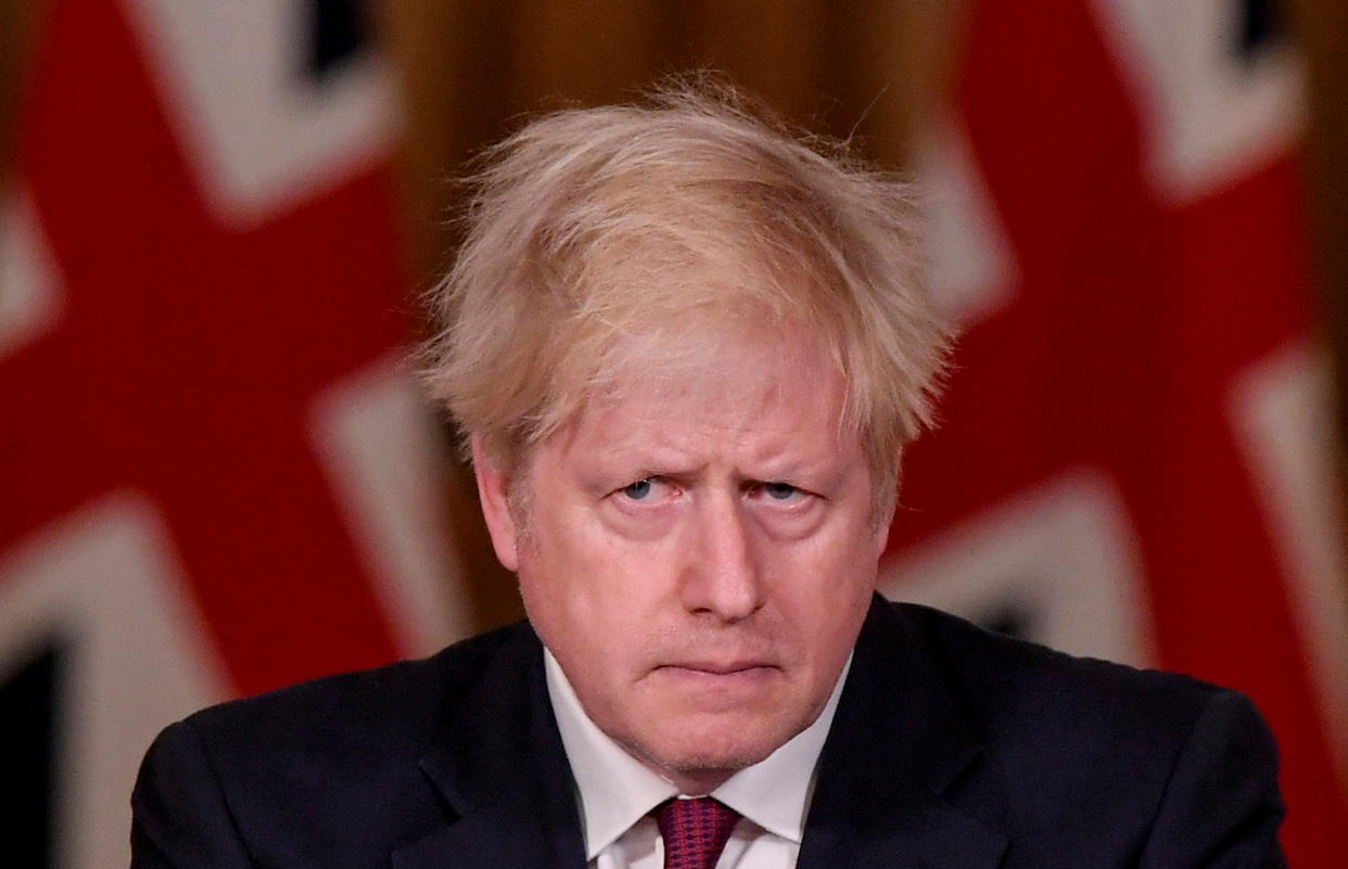 Britain's Prime Minister Boris Johnson looks on during a news conference in response to the ongoing situation with the coronavirus disease (COVID-19) pandemic, inside 10 Downing Street, London, Britain, December 19, 2020. REUTERS/Toby Melville/Pool     TPX IMAGES OF THE DAY