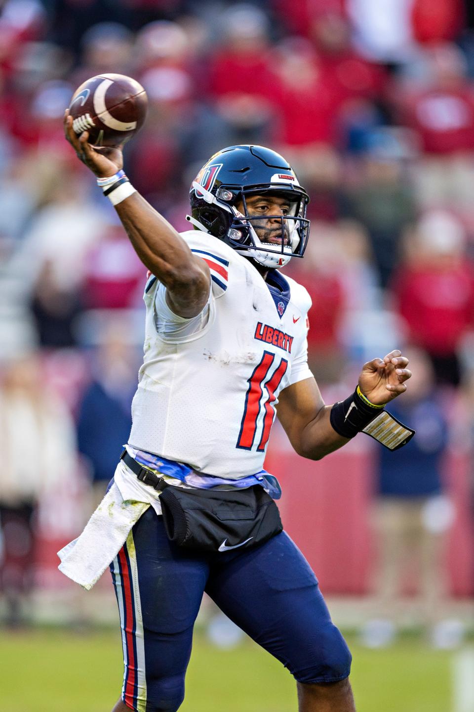 FAYETTEVILLE, ARKANSAS - NOVEMBER 05:  Johnathan Bennett #11 of the Liberty Flames throws a pass during the second half of a game against the Arkansas Razorbacks at Donald W. Reynolds Razorback Stadium on November 05, 2022 in Fayetteville, Arkansas. The Flames defeated the Razorbacks 21-19. (Photo by Wesley Hitt/Getty Images)