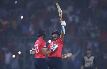 Cricket - England v New Zealand - World Twenty20 cricket tournament semi-final - New Delhi, India - 30/03/2016. England's Joe Root (R) and Jos Buttler celebrate after winning their match. REUTERS/Adnan Abidi