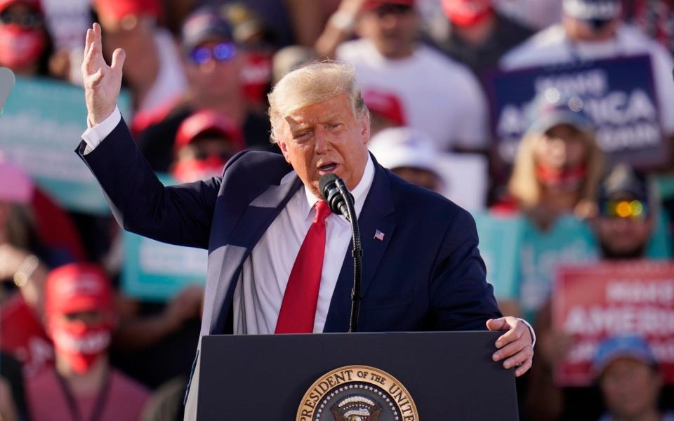 President Donald Trump speaks at a campaign rally in Arizona on Monday -  Ross D. Franklin/AP