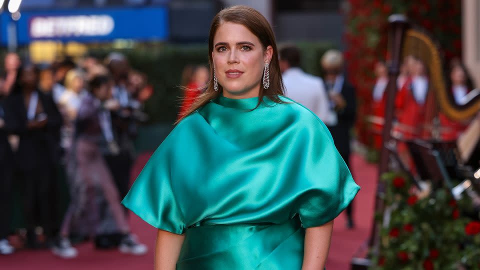 The late Queen Elizabeth II's granddaughter, Princess Eugenie, looked elegant in an emerald silk dress by Fendi. - Vianney Le Caer/Invision/AP