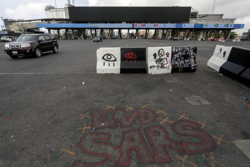 Words 'End Sars', referring to the Special Anti-Robbery Squad police unit, are written near the Lekki toll gate, in Lagos