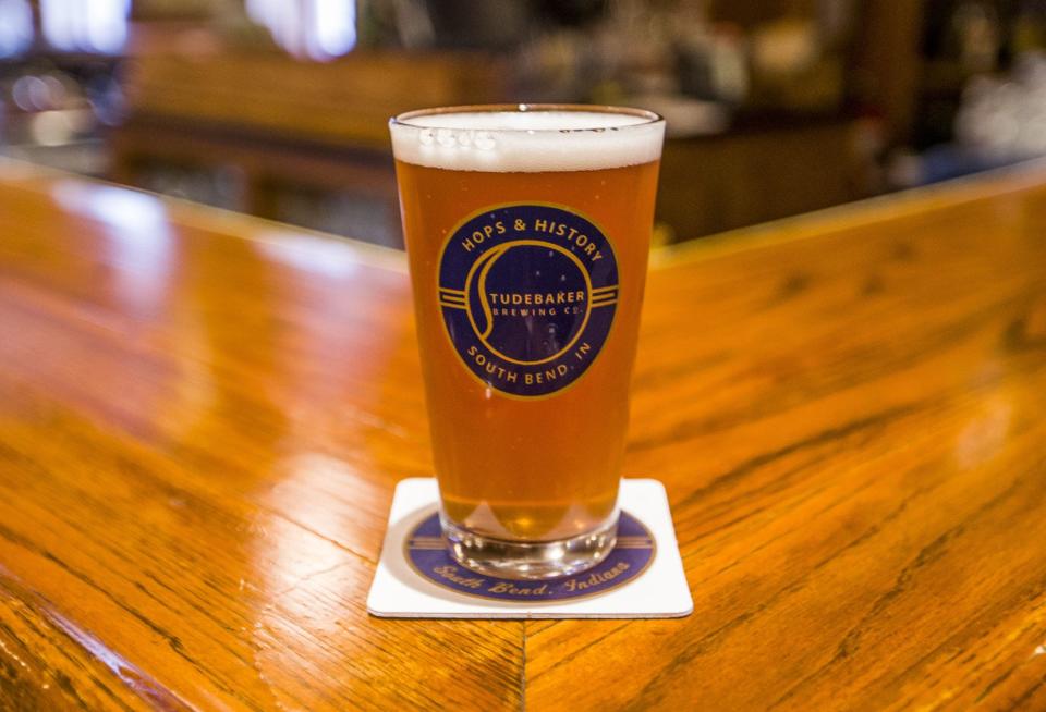 A glass of Summertime Blues fruit beer is shown inside Studebaker Brewing Company in South Bend.