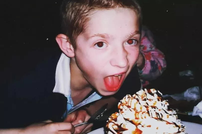 Young boy pictured next to a dessert- Mark Allen, who died aged 18 after drowning in a reservoir