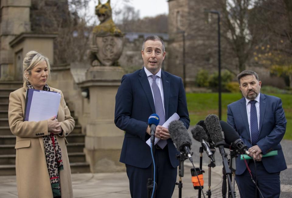 First Minister Paul Givan (centre), deputy First Minister Michelle O’Neill and Health Minister Robin Swann deliver a united message outside Stormont Castle (Liam McBurney/PA) (PA Wire)