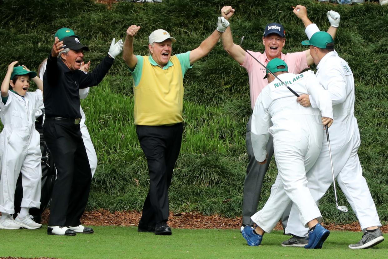 Jack Nicklaus celebrates with Tom Watson and Gary Player (L) after his grandson Gary (R) made a hole-in-one on the 9th hole during the Masters Par 3 Contest on Wednesday.