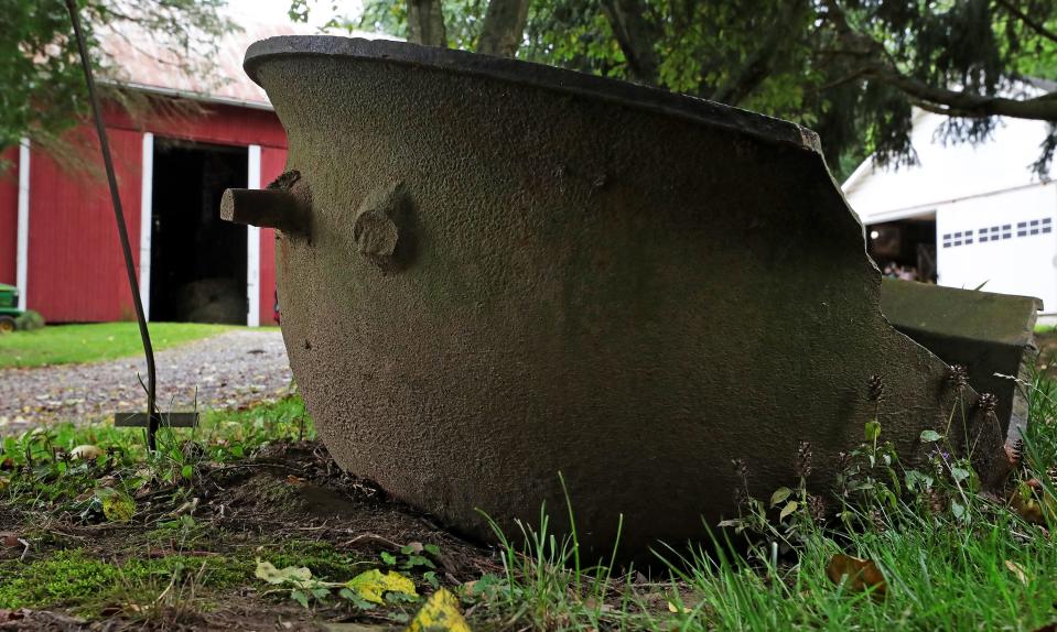 An old cauldron sits outside Crystal Farlin’s barn.