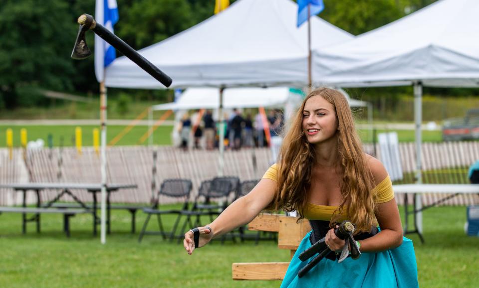 Elisebeth Sparks of Burlington demonstrates throwing a battle axe during the Wisconsin Highland Games in Waukesha on Sept. 1, 2019. The event returns Sept. 2-4, 2022, on the Waukesha County Expo Center grounds.