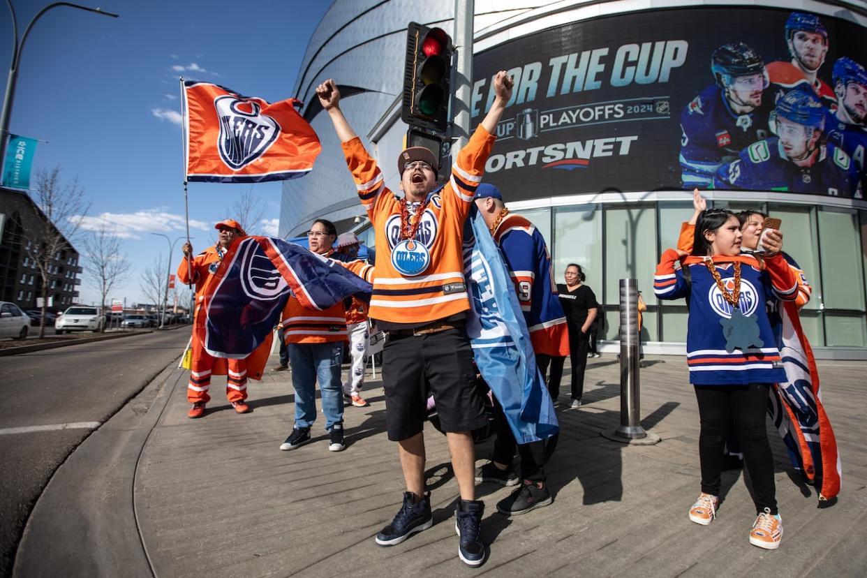 Oilers fans show their support before Game 1 of first-round Stanley Cup NHL hockey playoff action between the Edmonton Oilers and the Los Angeles Kings last month. (Jason Franson/The Canadian Press - image credit)