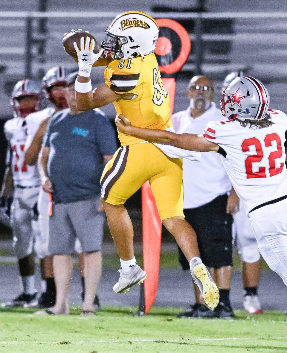 Golden West's Isaac Oceguera takes a pass under pressure from North Bakersfield's Jacob Sanders in non-league high school football on Thursday, September 12, 2024.