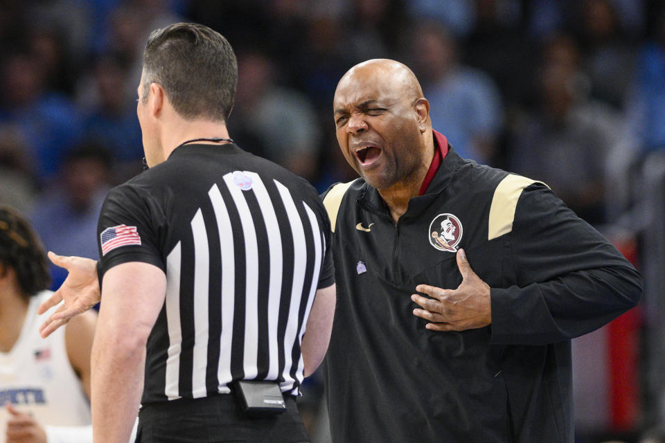 Florida State head coach Leonard Hamilton speaks with a referee during the first half of an NCAA college basketball game against North Carolina in the quarterfinal round of the Atlantic Coast Conference tournament, Thursday, March 14, 2024, in Washington. (AP Photo/Nick Wass)