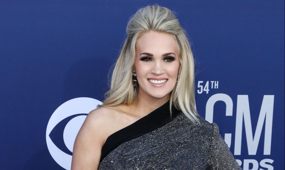 carrie underwood as one of the blonde country singers at the acm awards