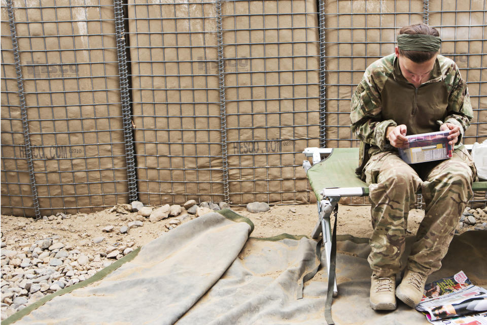 Family memento: Cpt Crossley, 31, opens a package sent to her from home by her mother Carol (Alison Baskerville)