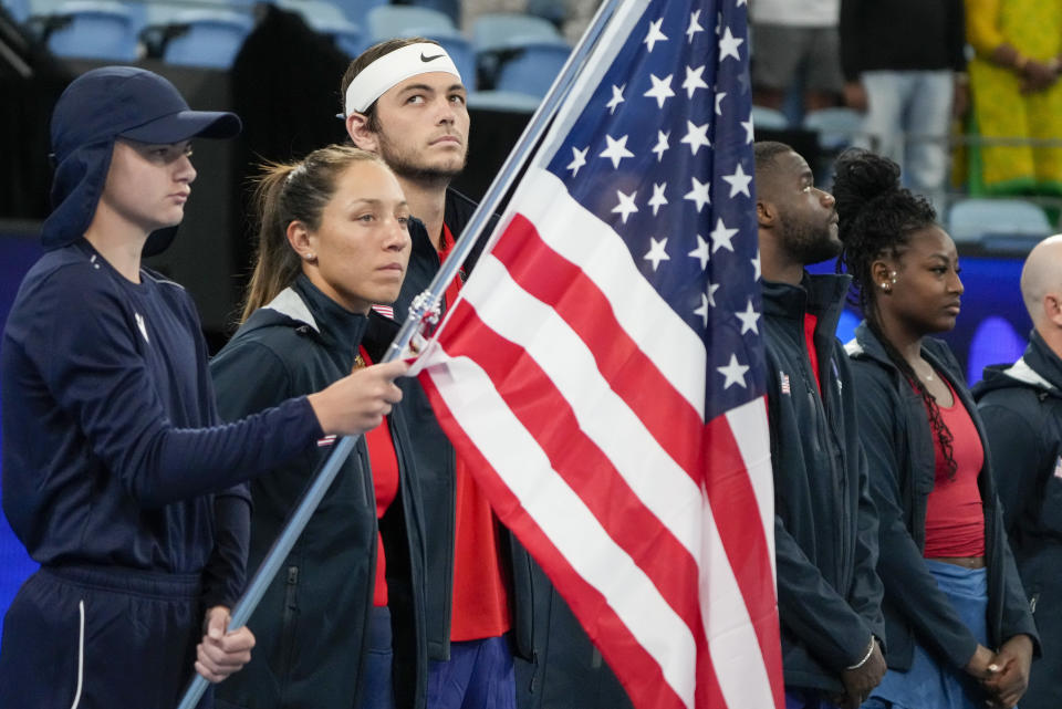 United States' Taylor Fritz, third left, reacts as he line sup with his teammates ahead of their Group C match against the Czech Republic at the United Cup tennis event in Sydney, Australia, Thursday, Dec. 29, 2022. (AP Photo/Mark Baker)