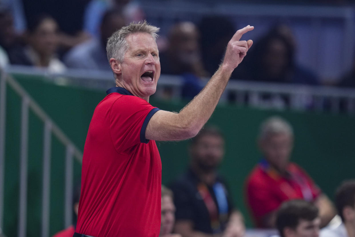 U.S. head coach Steve Kerr calls a play for his team as they player against Lithuania during the first half of a Basketball World Cup second-round match in Manila, Philippines Sunday, Sept. 3, 2023.(AP Photo/Michael Conroy)