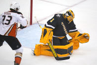 Pittsburgh Penguins goaltender Casey DeSmith (1) blocks a shot with Anaheim Ducks' Sam Steel (23) looking for a rebound during the first period of an NHL hockey game in Pittsburgh, Saturday, Dec. 11, 2021.(AP Photo/Gene J. Puskar)